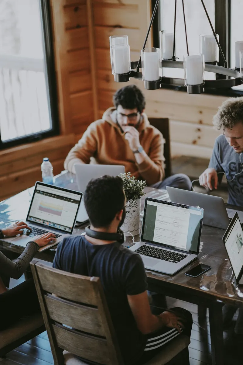 A technology team working together around a table